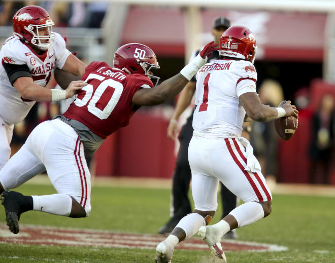 Alabama defensive lineman Tim Smith (50) pressures Arkansas quarterback KJ Jefferson (1) at Bryant-Denny Stadium. Photo | Gary Cosby Jr.-USA TODAY Sports