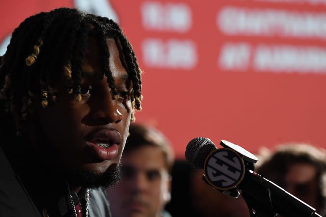 Alabama Crimson Tide offensive lineman JC Latham (65) talks with members of the media during SEC Media Day at the Grand Hyatt. Photo | Christopher Hanewinckel-USA TODAY Sports