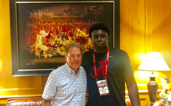 Five-star DE Tunmise Adeleye with Nick Saban in 2019.