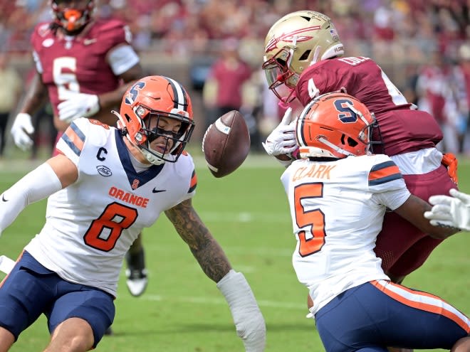 Oct 14, 2023; Tallahassee, Florida, USA; Florida State Seminoles wide receiver Keon Coleman (4) fumbles the ball as he is tackled by Syracuse Orange defensive back Alijah Clark (5) during the first quarter at Doak S. Campbell Stadium. Mandatory Credit: Melina Myers-USA TODAY Sports
