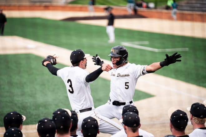 Wake Forest's Seaver King, right, celebrates with Adam Tellier during Tuesday night's game. 