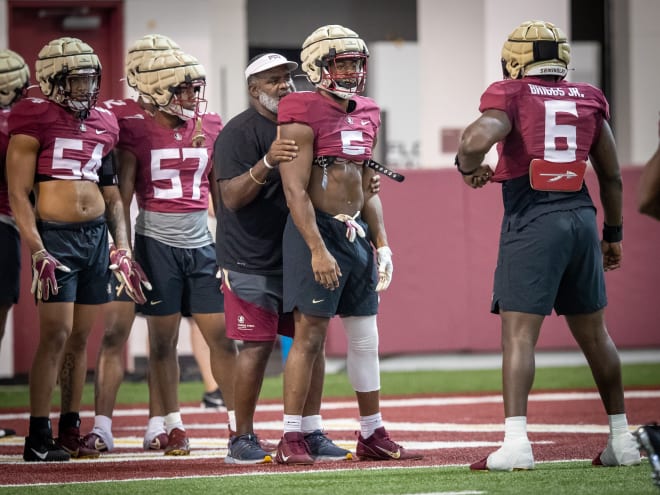 Jared Verse is motivated to take his game to the next level and has been helped on the field by Odell Haggins (above) and John Papuchis. (photo by Ross Obley / The Osceola)