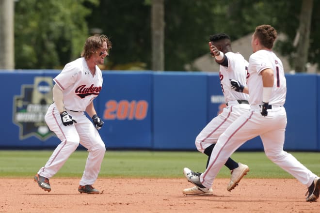 Jarvis celebrates the walk-off win with his teammates.