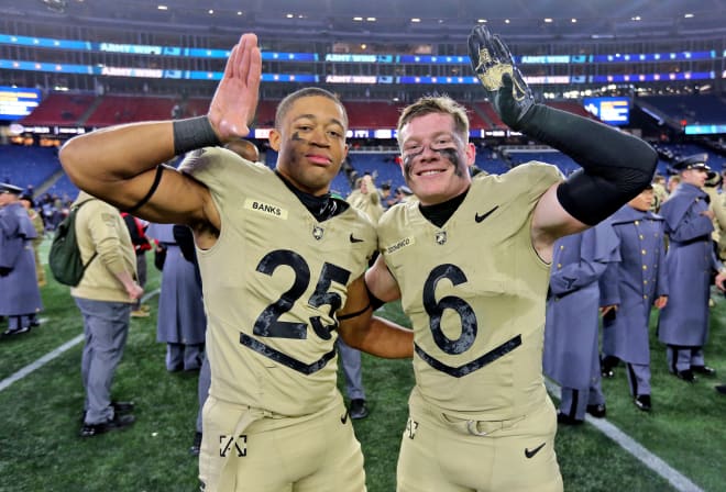 LB Josiah.Banks (25) and safety Max.DiDomenico (6.) celebrate after Army's win against Navy.