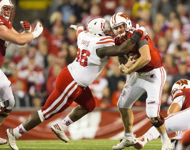 Carlos Davis separated his shoulder and popped it back into place on the field at Wisconsin.