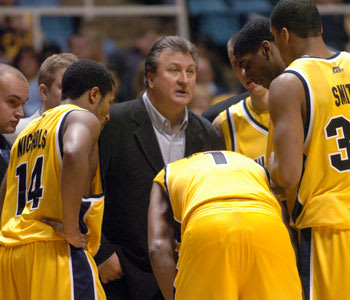 Nichols, left, played under West Virginia Mountaineers basketball head coach Bob Huggins.