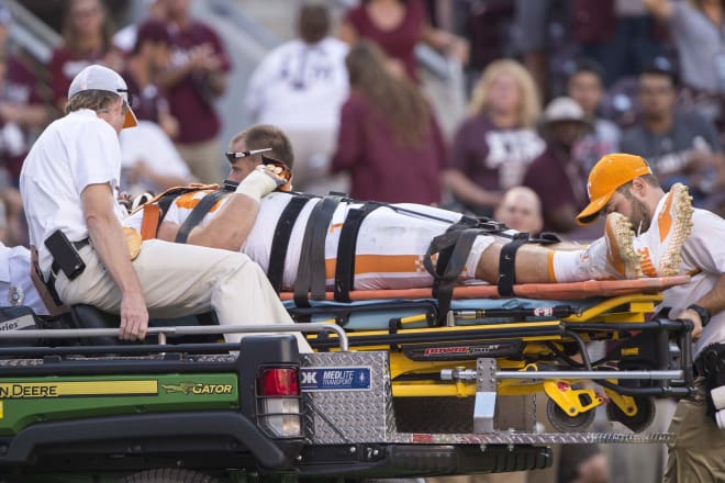 O'Brien is carted off the field during Tennessee's game against Texas A&M.