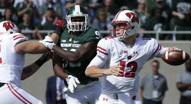 Alex Hornibrook made his first collegiate start at No.8 Michigan State and picked the Spartans apart.