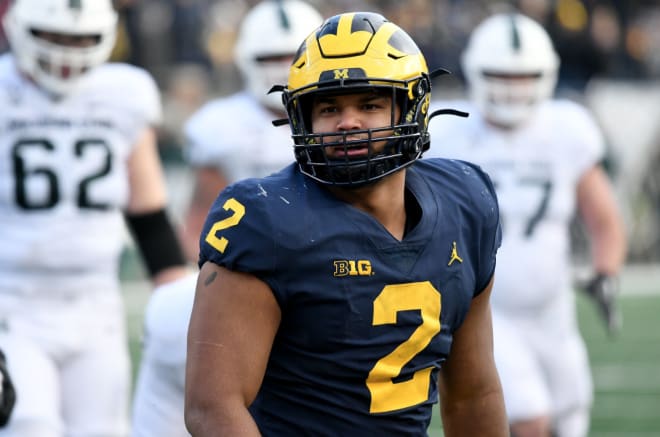 Michigan Wolverines football fifth-year senior defensive tackle Carlo Kemp had a sack against Wisconsin.