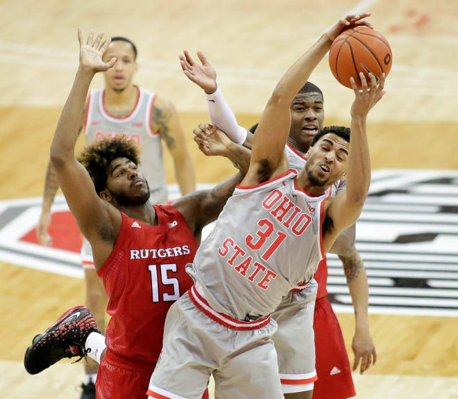 Ohio State Buckeyes forward Seth Towns (31) grabs a rebound away frmo Rutgers Scarlet Knights center Myles Johnson (15) during the second half of Wednesday's NCAA Division I basketball game at Value City Arena in Columbus, Oh. on December 23, 2020. 