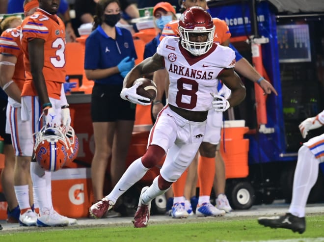 Mike Woods had a pair of long touchdowns in Arkansas' loss at No. 6 Florida.