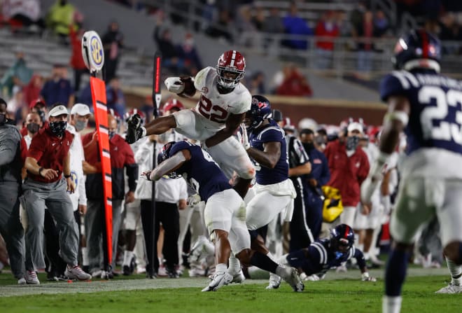 Najee Harris hurdles a defender during last month's game against Ole Miss. Photo | Getty Images