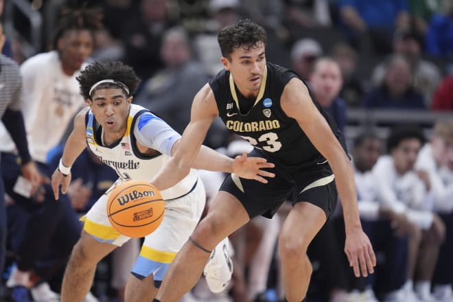 Tristan da Silva (23) chase a loose ball during the first half in the second round game vs. Marquette.