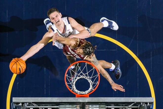 Irish forward Nate Laszewski (14) shoots over Boston College guard Makai Ashton-Langford (11) in the second half at the Purcell Pavilion on Saturday.