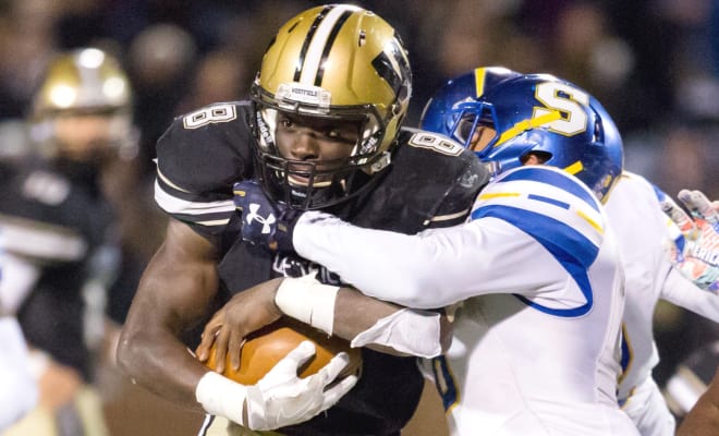 Eugene Asante powers the running game for the Bulldogs, seeking a fourth straight state title