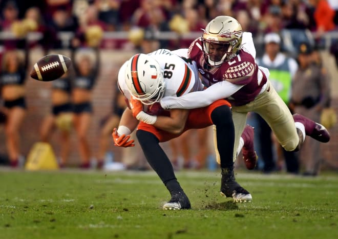FSU safety Akeem Dent delivers a big hit earlier this season against Miami tight end Will Mallory.