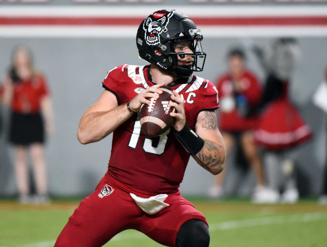 Sep 24, 2022; Raleigh, North Carolina, USA; North Carolina State Wolfpack quarterback Devin Leary (13) looks to throw during the first half against the Connecticut Huskies at Carter-Finley Stadium. (Rob Kinnan-USA TODAY Sports)