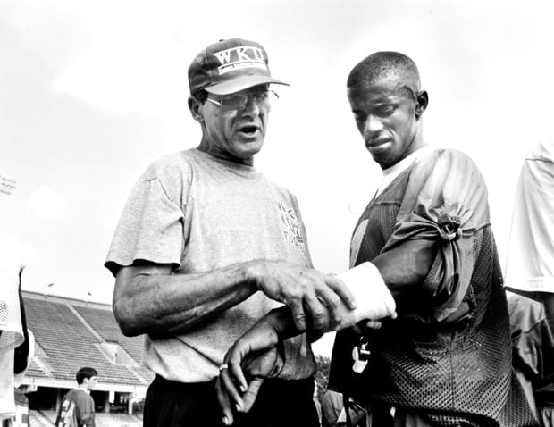 Willie Taggart, shown in his Western Kentucky playing days, with his mentor, Jack Harbaugh.