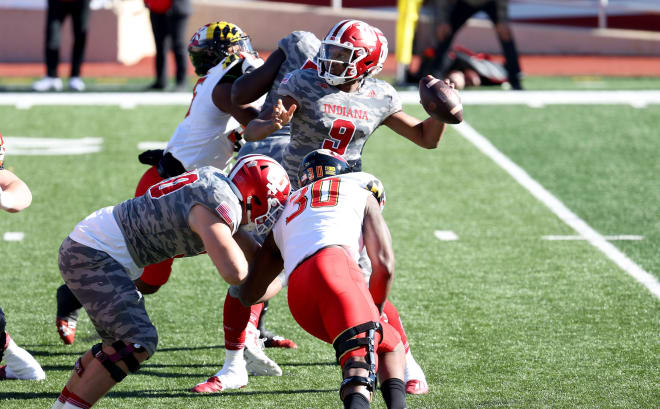 Michael Penix Jr. passing under pressure versus Maryland (Getty Images)