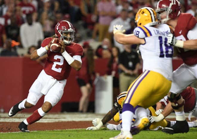 Alabama Crimson Tide quarterback Jalen Hurts (2) scrambles out of the end zone under pressure form the LSU Tigers defense during the first quarter at Bryant-Denny Stadium. Photo | USA Today