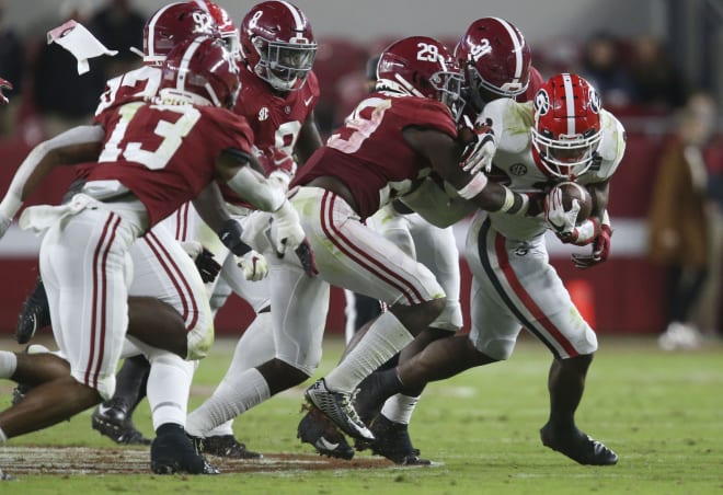 A swarm of Alabama defenders work to bring down Georgia running back Zamir White (3) during the second half of Alabama's 41-24 win over Georgia at Bryant-Denny Stadium. Photo | Imagn