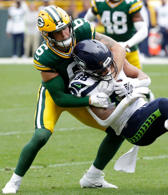 Green Bay Packers safety Dallin Leavitt (6) brings down Seattle Seahawks wide receiver Cade Johnson (88) during their preseason football game Saturday, August 26, 2023, at Lambeau Field in Green Bay, Wis. Photo credit: Sarah Kloepping/USA TODAY NETWORK-Wisconsin/USA TODAY NETWORK