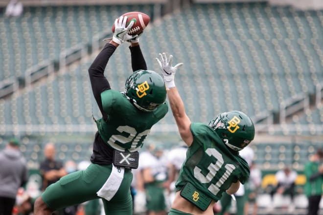 January 2021 enrollee Devin Lemear going through warmup drills Saturday. 