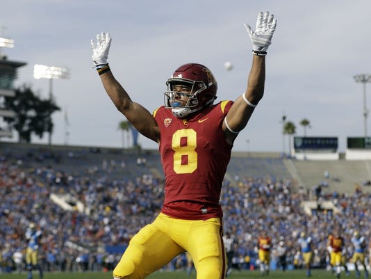 USC wide receiver Amon-Ra St. Brown (8) celebrating a touchdown last season (AP Photo/Marcio Jose Sanchez)