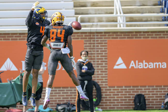 Michigan Wolverines football wideout Nico Collins after scoring a touchdown in Senior Bowl practice.