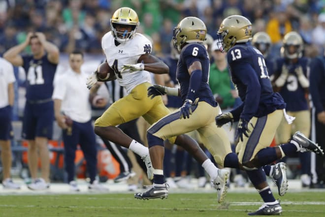 Notre Dame wide receiver Kevin Austin Jr. runs with the ball after a reception during the first half of an NCAA college football game against Navy Saturday, Oct. 27, 2018, in San Diego. (AP Photo/Gregory Bull)
