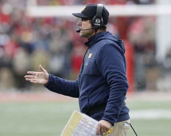 Michigan head coach Jim Harbaugh and his team face Rutgers Saturday in Ann Arbor as four-touchdown favorites. 