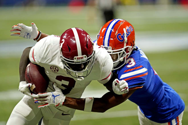 Alabama Crimson Tide wide receiver Xavier Williams (3) runs the ball against Florida Gators defensive back Marco Wilson (3) during the first half in the SEC Championship at Mercedes-Benz Stadium.  Photo | USA TODAY