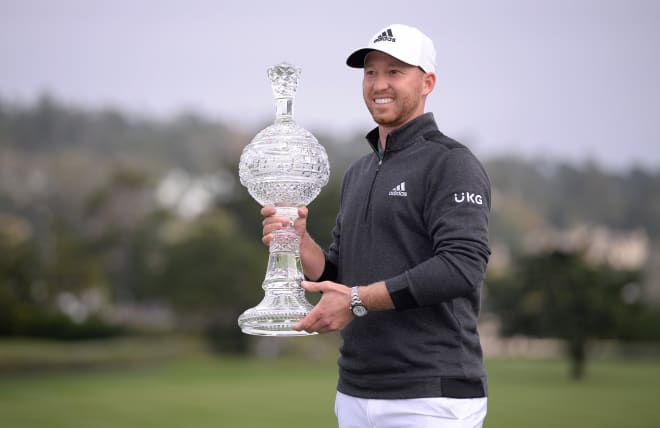 Former FSU golfer Daniel Berger poses for pictures after winning Sunday at Pebble Beach.