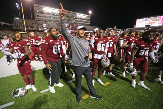 Look at No. 79 in the back. My guy wants nothing to do with this happy Troy Trojans sing-along. No, sir, he's ready to go to some happening spots in Troy (like Applebee's or something) and get some quesadillas and a cold one and wonder how his college football dreams fell to this point.
