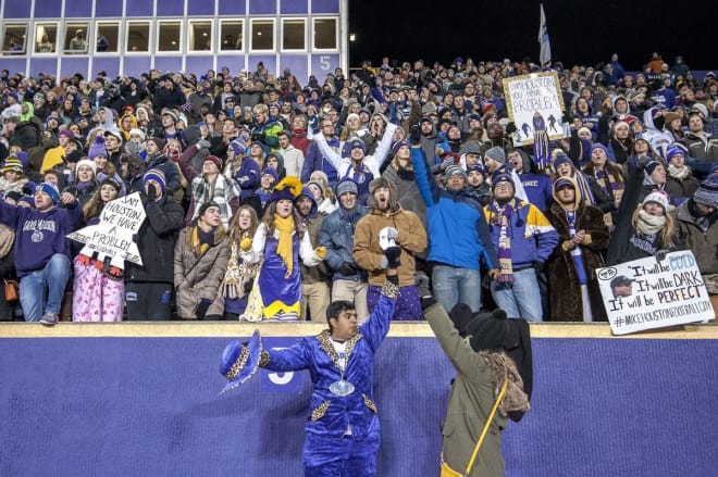 James Madison University football fans celebrate during the Dukes' 65-7 rout of Sam Houston State in the FCS national quarterfinals at Bridgeforth Stadium last season.