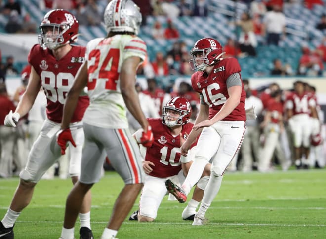 Alabama Crimson Tide kicker Will Reichard (16) connects on a kick against Ohio State in the national championship game. Photo | Getty Images 