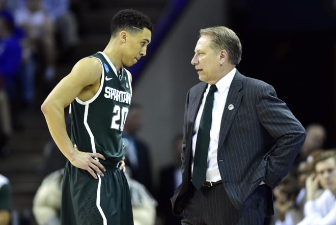 Michigan State Spartans head coach Tom Izzo talks with Michigan State Spartans guard Travis Trice (20) during the first half against the Virginia Cavaliers in the third round of the 2015 NCAA Tournament at Time Warner Cable Arena.