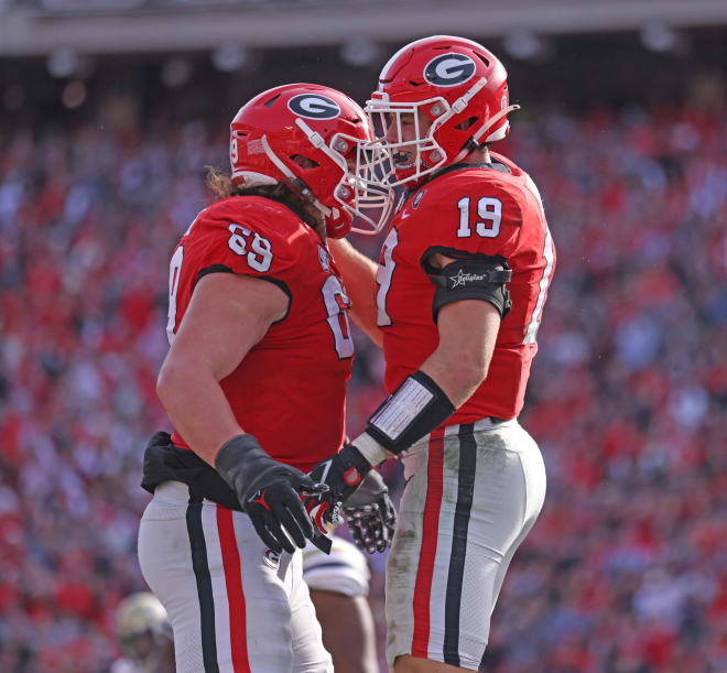 Brock Bowers and Tate Ratledge celebrate during Georgia's win over Georgia Tech. (Tony Walsh/UGA Sports Communications)