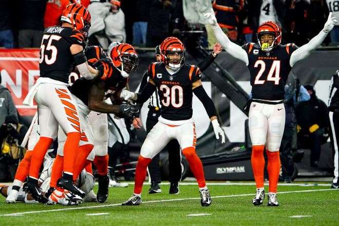 Cincinnati Bengals linebacker Germaine Pratt (57) and the Cincinnati Bengals defense celebrate Pratt s interception to seal with win in the fourth quarter during an NFL AFC wild-card playoff game, Saturday, Jan. 15, 2022, at Paul Brown Stadium in Cincinnati. The Cincinnati Bengals defeated the Las Vegas Raiders, 26-19, to win the franchise's first playoff game in 30 years.