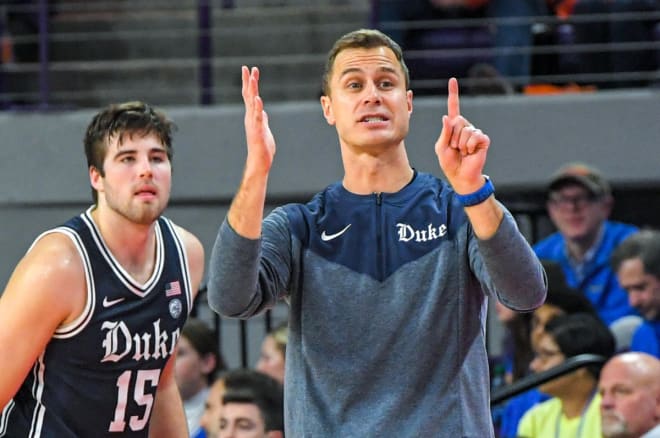 Duke's Ryan Young, left, and Jon Scheyer are fired up for the football team's success. 
