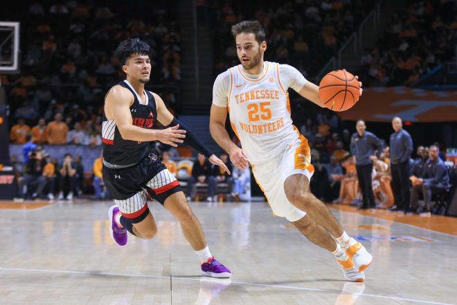 Tennessee guard Santiago Vescovi drives on Austin Peay's Carolos Paez in the first half. 