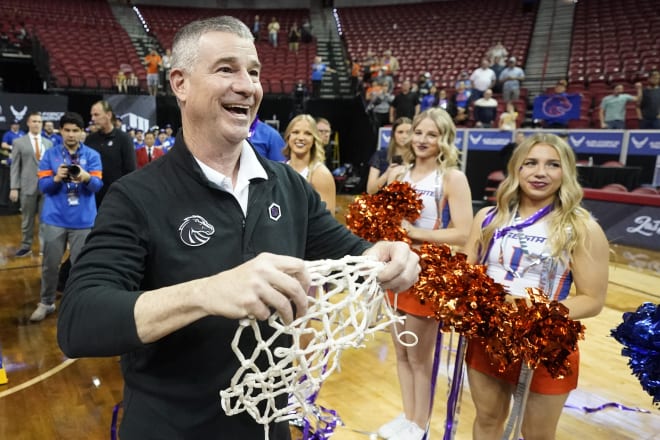 Boise State head coach Leon Rice celebrates after cutting down the net following their victory over San Diego State after an NCAA college basketball game in the finals of Mountain West Conference men's tournament Saturday, March 12, 2022, in Las Vegas.