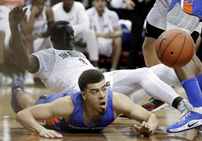 Boise State's Alex Hobbs (34) and San Diego State's Aguek Arop (3) go for a loose ball during the second half of an NCAA college basketball game in the Mountain West Conference men's tournament Friday, March 6, 2020, in Las Vegas.