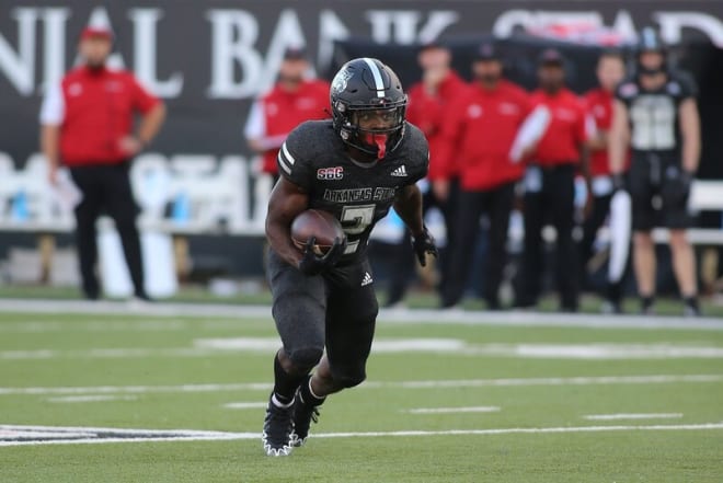 Johnnie Lang Jr. had a rushing touchdown, receiving touchdown, and kickoff return touchdown for the Red Wolves
