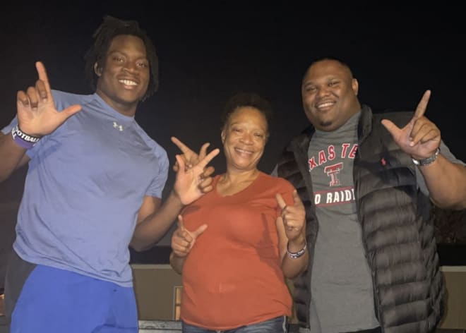 Joseph Adedire with his mom and Texas Tech DL coach Zarnell Fitch during an in-home visit