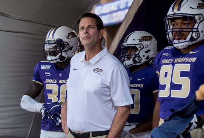 James Madison coach Curt Cignetti and his players get set to take the field before a contest against Morgan State last year at Bridgeforth Stadium.