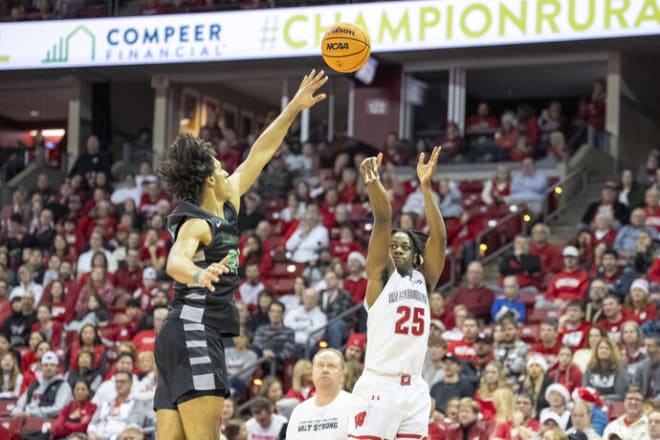 Wisconsin's John Blackwell (25) shoots against Chicago State's Jahsean Corbett (24)