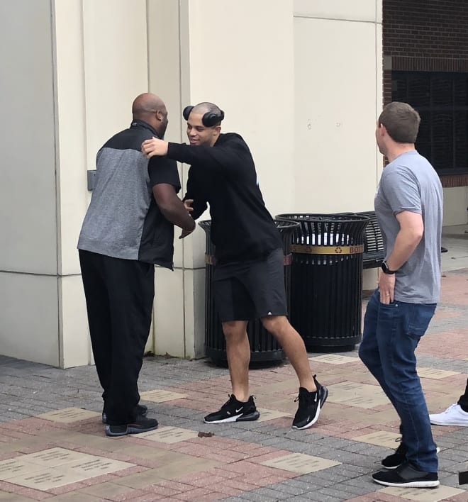 Oregon wide receiver transfer Mycah Pittman gives FSU receivers coach Ron Dugans a quick hug upon arriving back at the Moore Center on Sunday.
