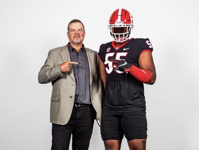 Rivals250 offensive lineman Michael Uini with Georgia offensive line coach Stacy Searels. Photo via Uini's Instagram.