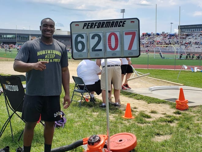 Adetomiwa Adebawore broke the Missouri state record with a shot put throw of 62' 7.75".